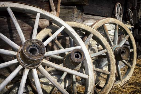 Old wagon wheels with strakes.